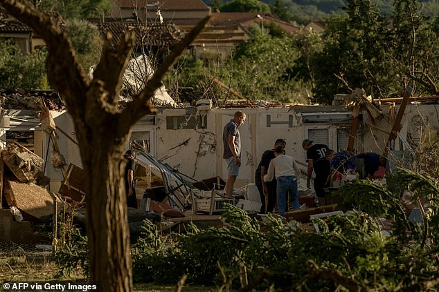 This pH๏τograph taken on Monday shows a damaged structure after a tornado struck Pomas
