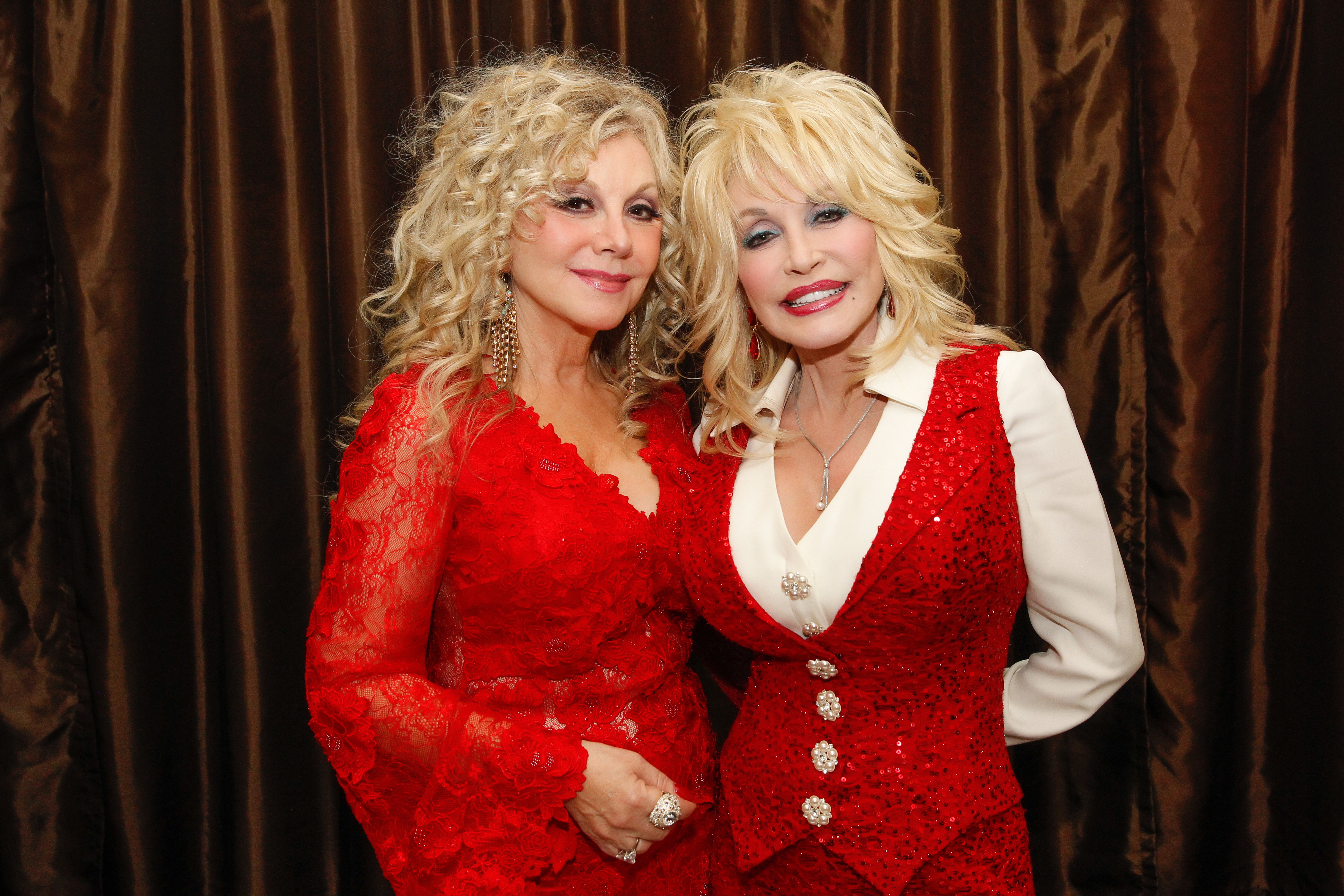 Stella and Dolly Parton posing together.