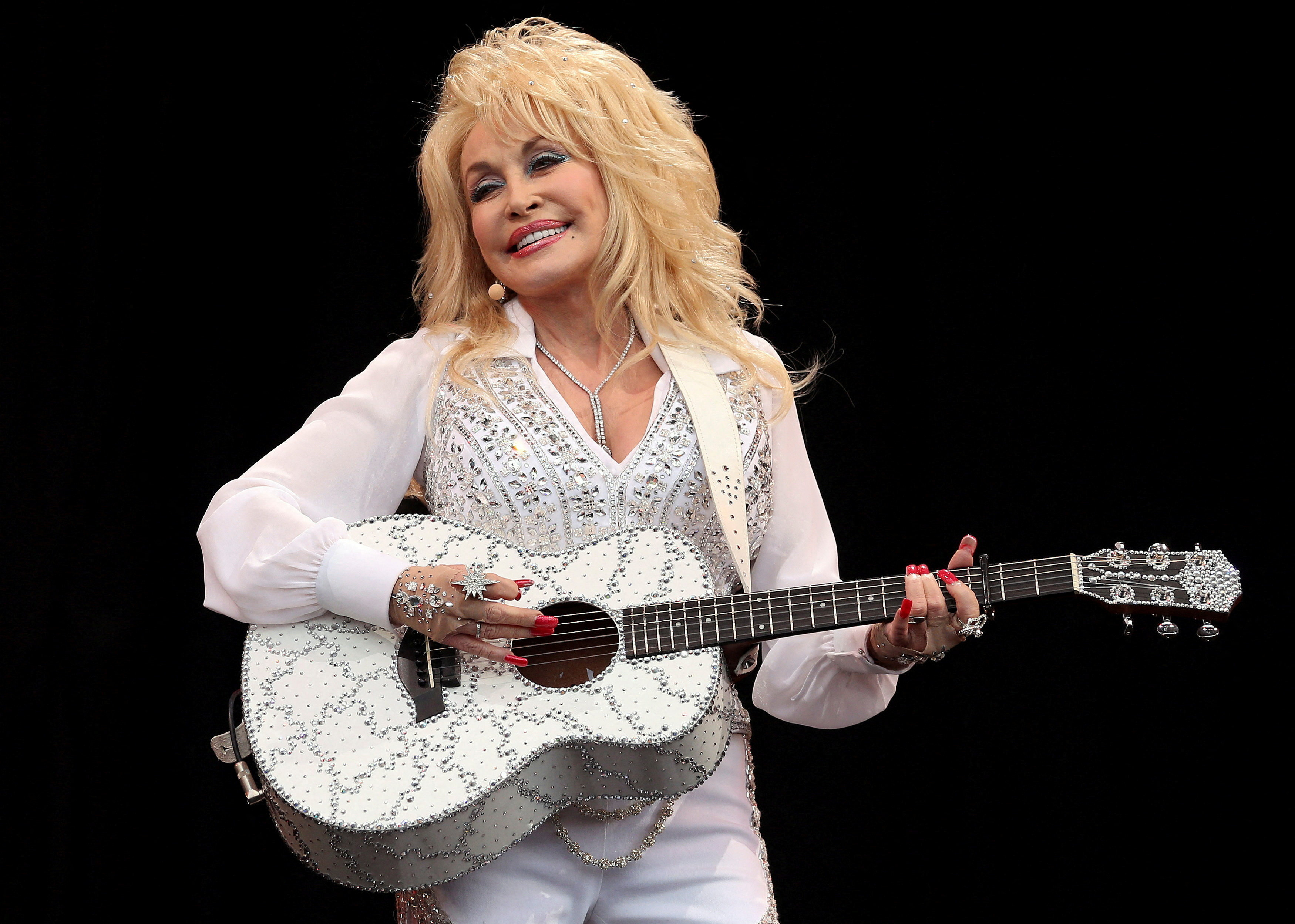 American country music star Dolly Parton performs on the Pyramid Stage at Worthy Farm in Somerset, during the Glastonbury Festival June 29, 2014.