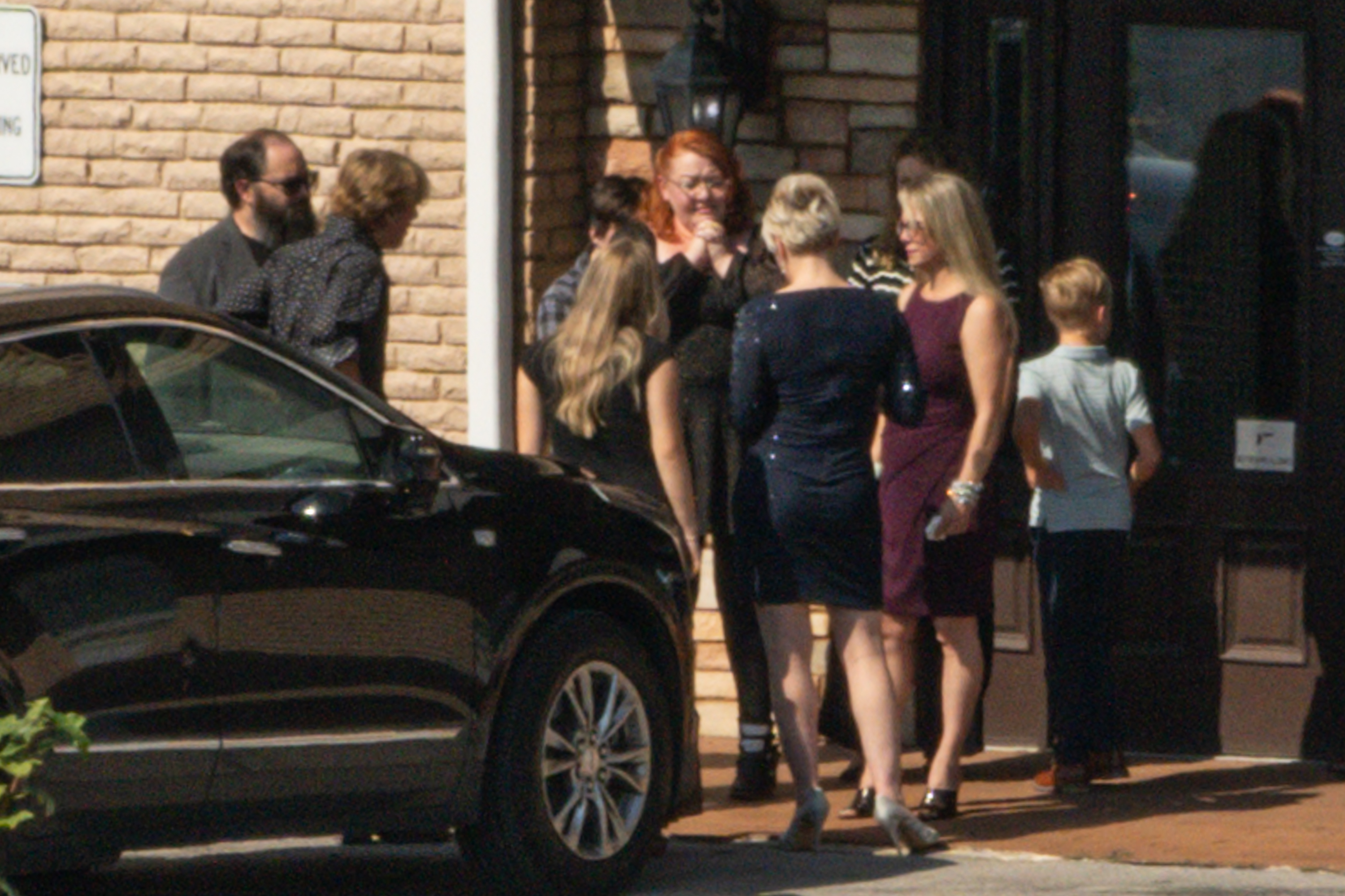 Bryan Seaver with what appears to be Dolly Parton's family at a funeral home.